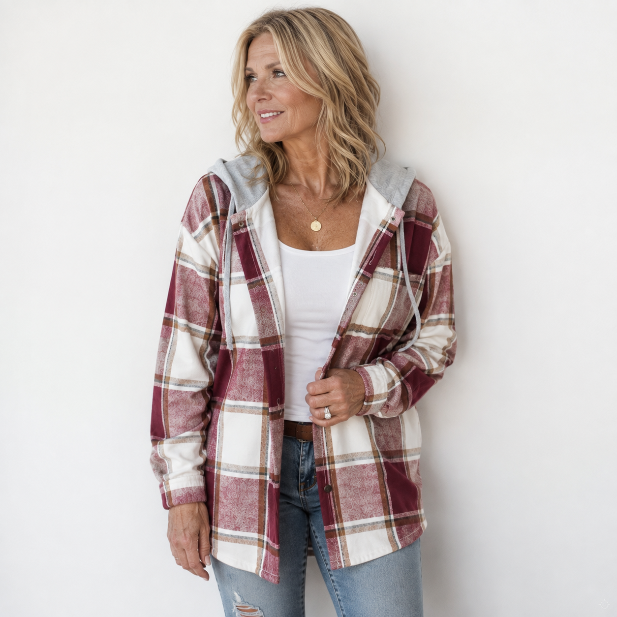 Woman wearing a cosy plaid hooded jacket with a soft, comfortable fit