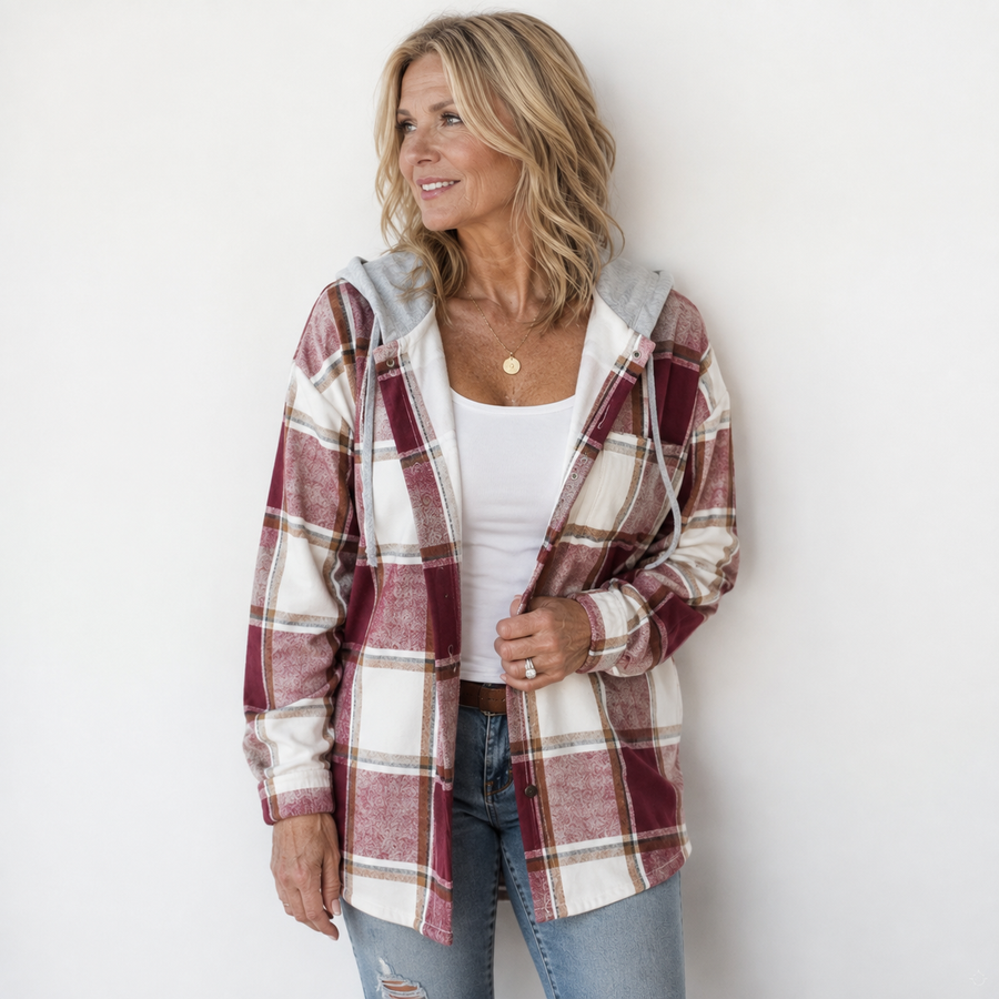 Woman wearing a cosy plaid hooded jacket with a soft, comfortable fit