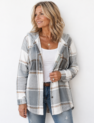 Woman wearing a cosy plaid hooded jacket with a soft, comfortable fit