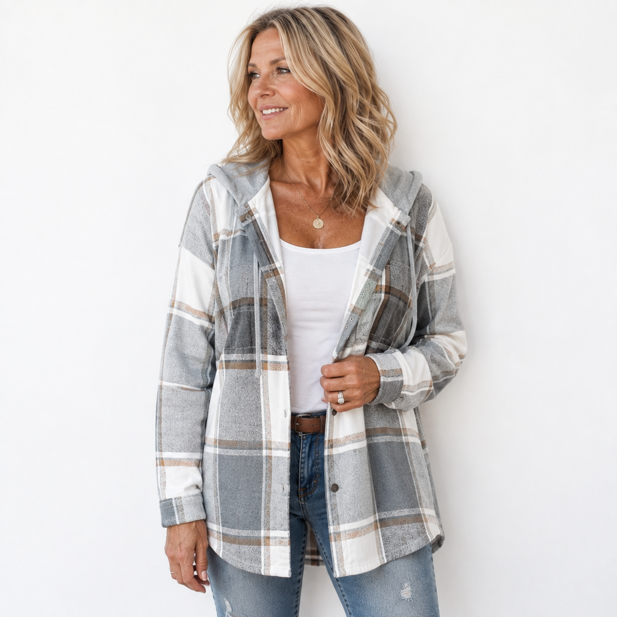 Woman wearing a cosy plaid hooded jacket with a soft, comfortable fit