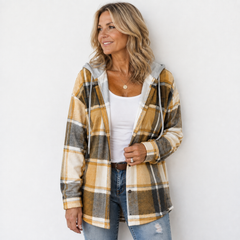 Woman wearing a cosy plaid hooded jacket with a soft, comfortable fit