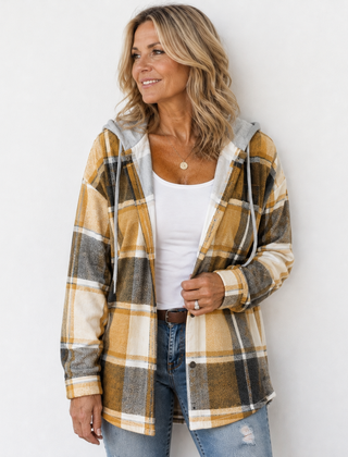 Woman wearing a cosy plaid hooded jacket with a soft, comfortable fit