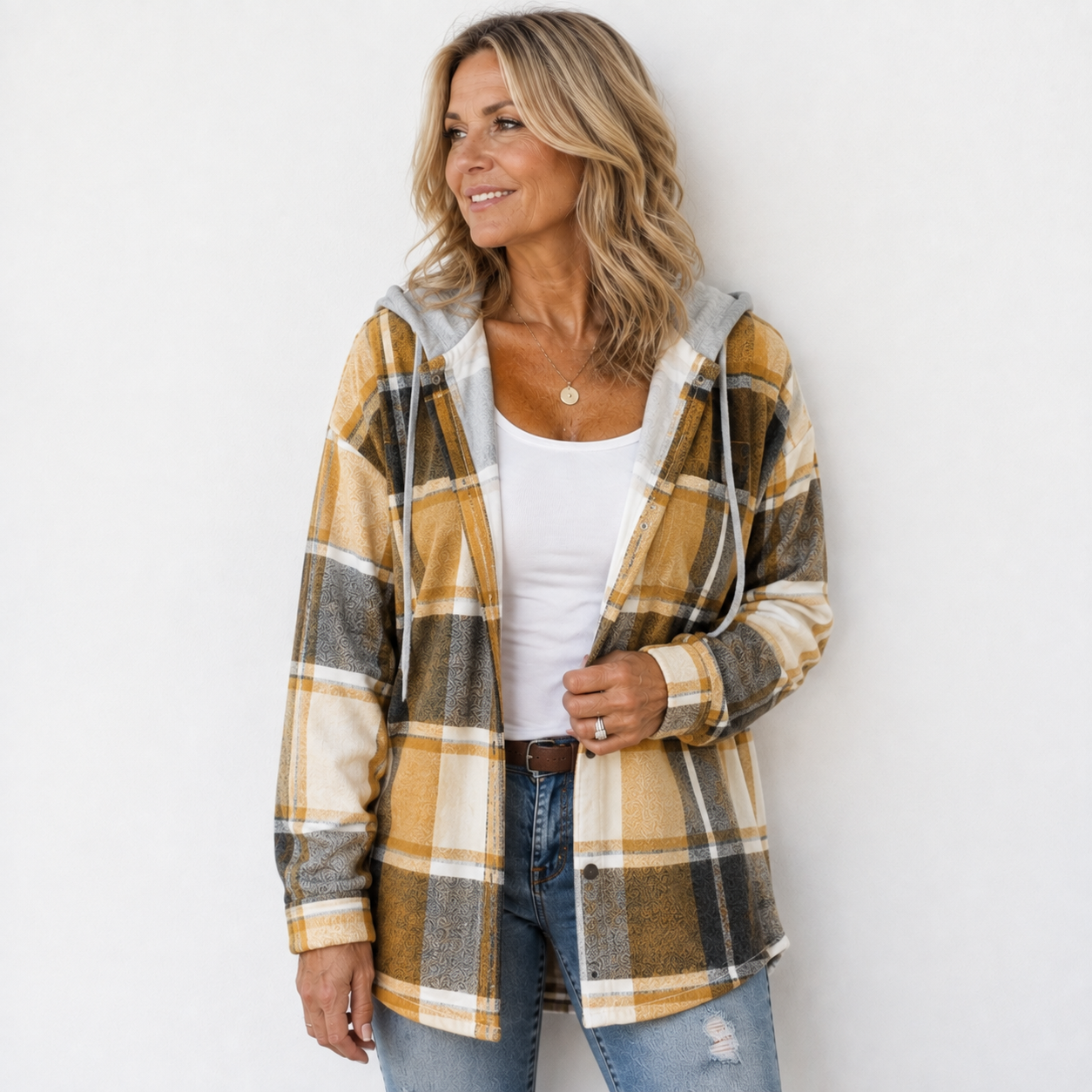 Woman wearing a cosy plaid hooded jacket with a soft, comfortable fit