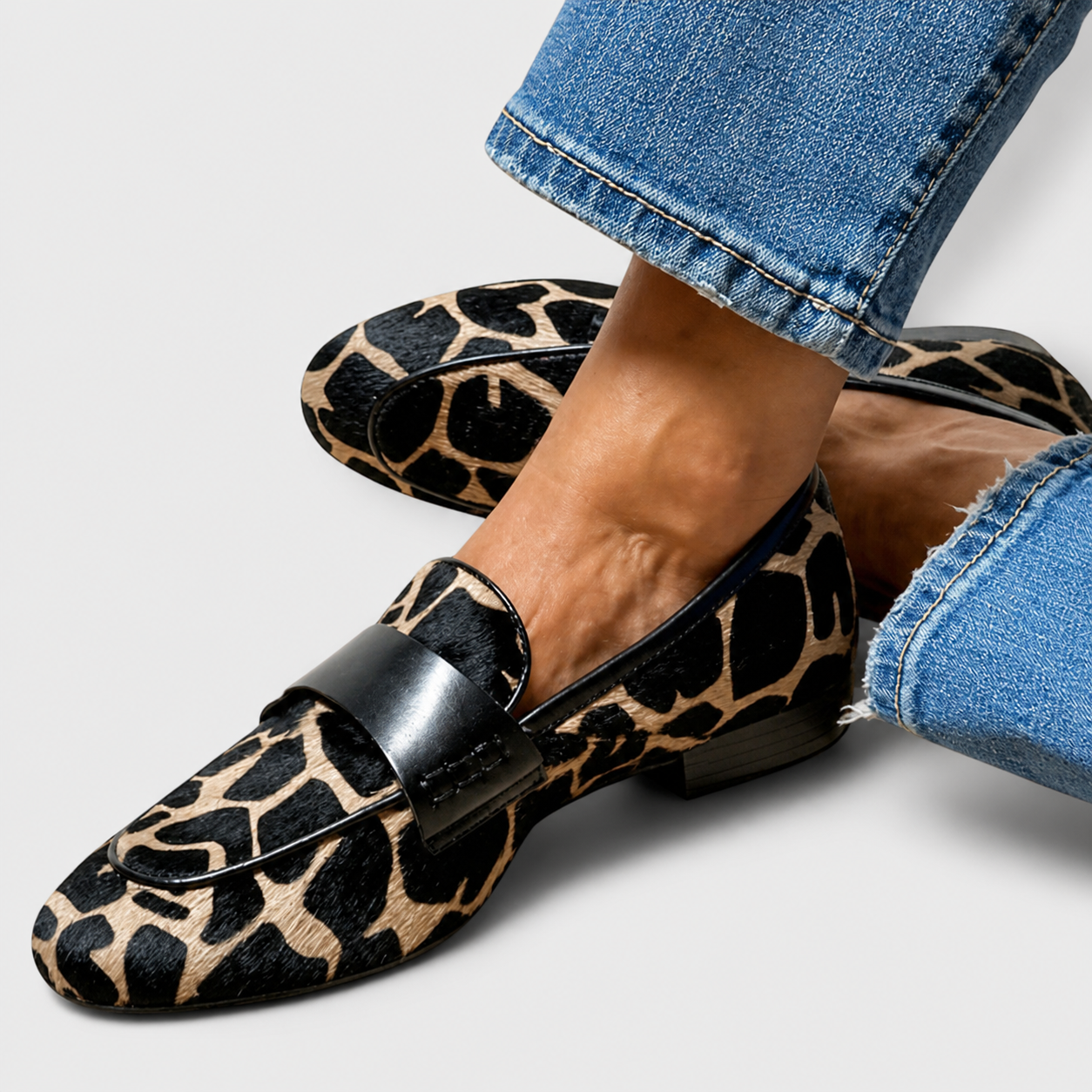 Leopard print slip-on loafers for women with a refined, structured design