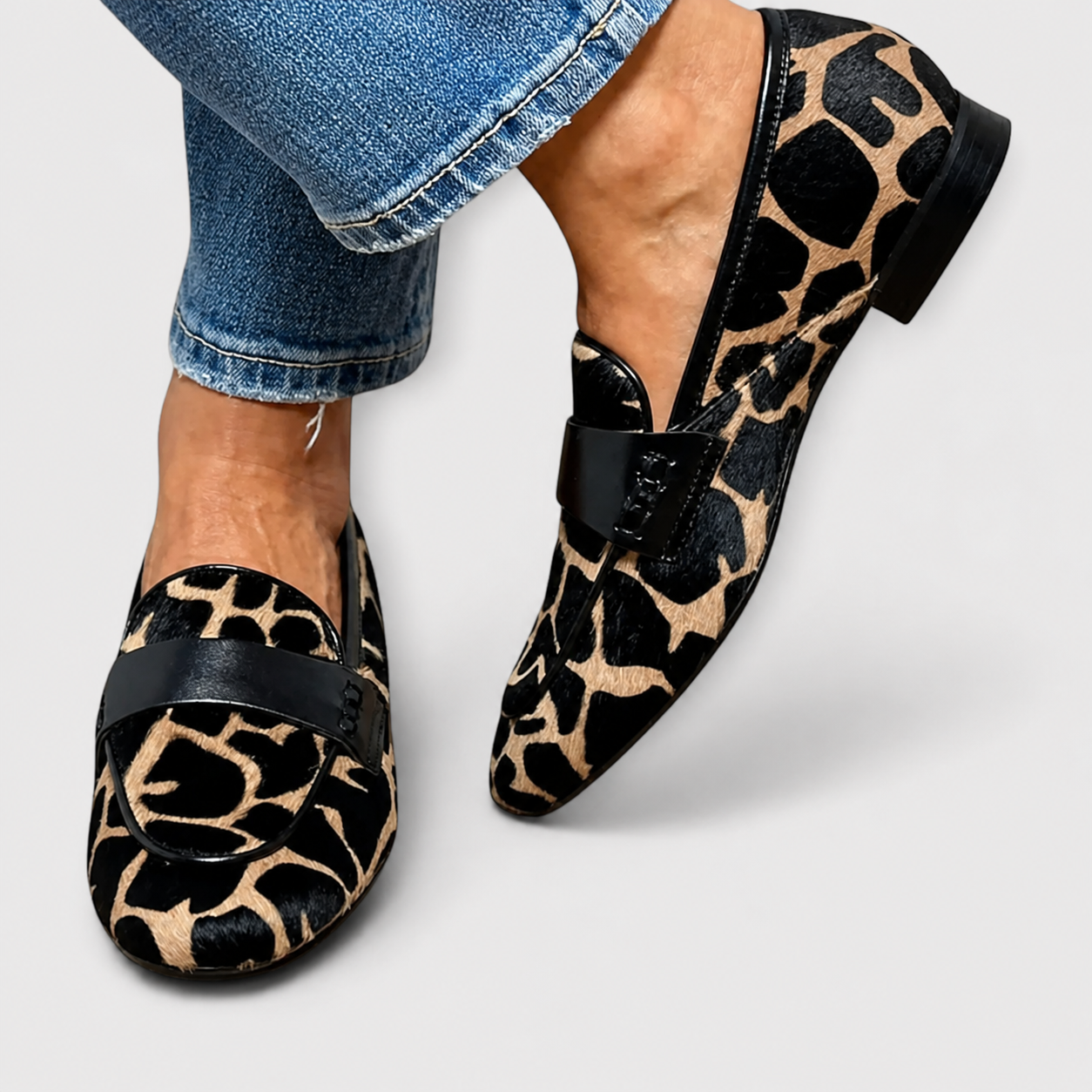 Leopard print slip-on loafers for women with a refined, structured design