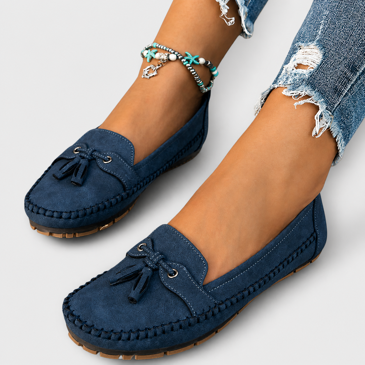 Classic slip-on loafers shown in blue, grey, pink and brown shades