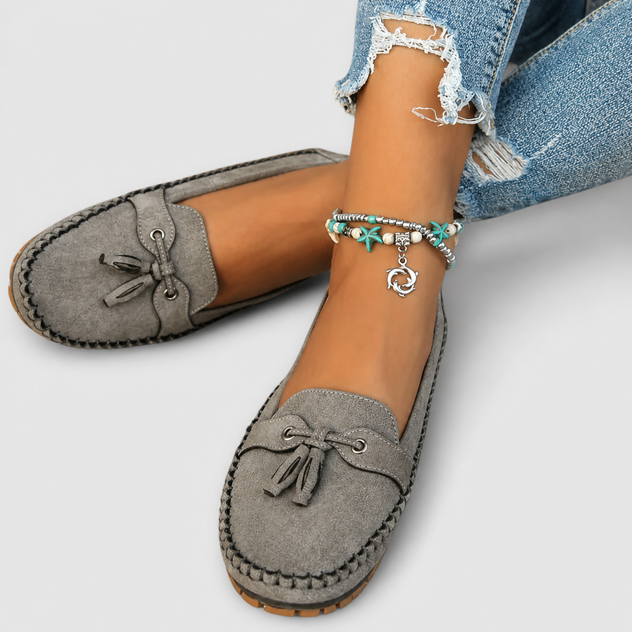 Classic slip-on loafers shown in blue, grey, pink and brown shades