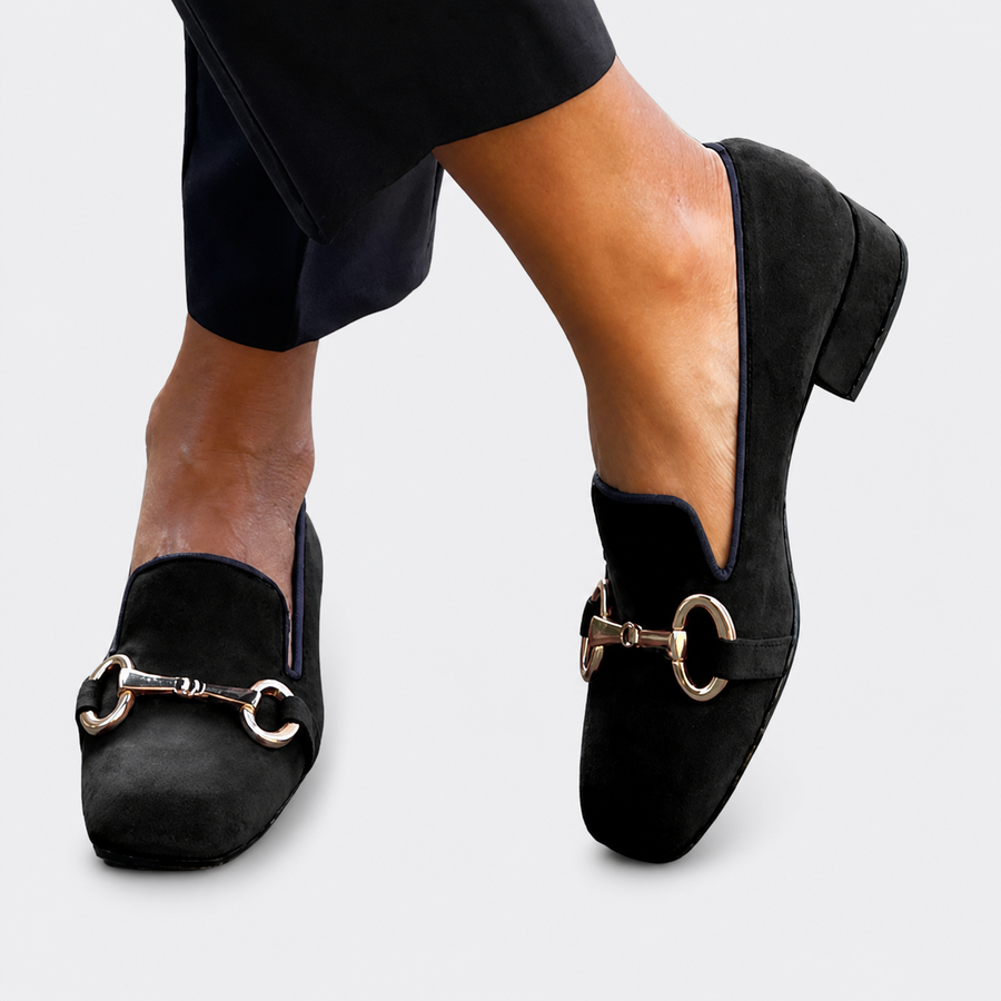 Women's slip-on loafers with a decorative buckle detail