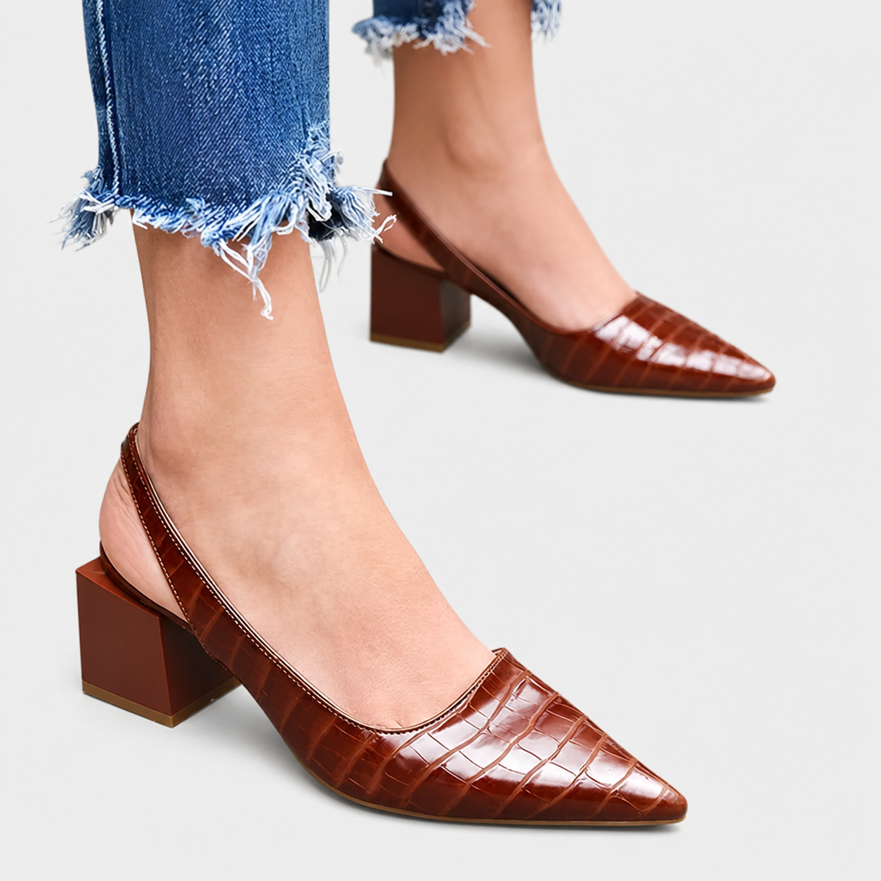 Elegant heeled women's shoes with refined detailing in black and brown