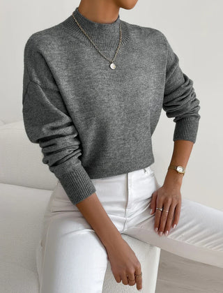 Women's crew neck sweater with ribbed cuffs and hemline in a solid shade