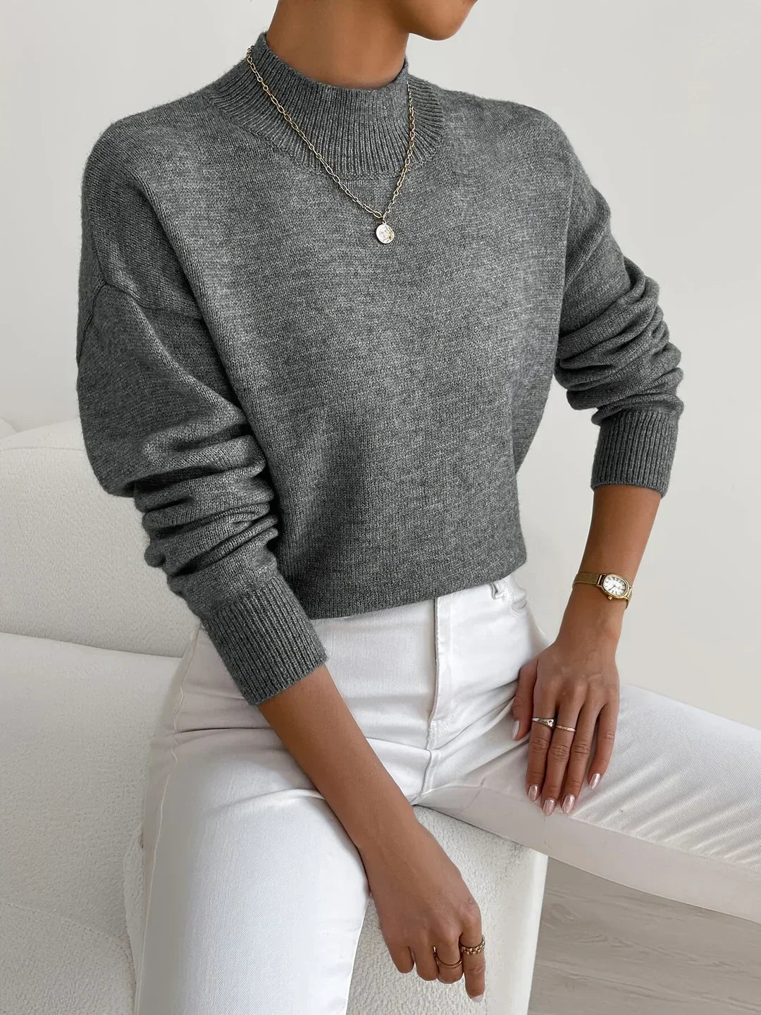 Women's crew neck sweater with ribbed cuffs and hemline in a solid shade