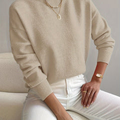 Women's crew neck sweater with ribbed cuffs and hemline in a solid shade