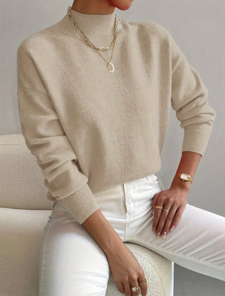 Women's crew neck sweater with ribbed cuffs and hemline in a solid shade