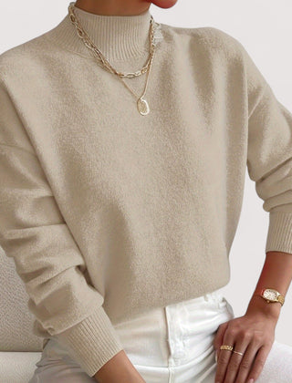 Women's relaxed crew neck long sleeve sweater with ribbed cuffs and hemline