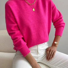 Women's crew neck sweater with ribbed cuffs and hemline in a solid shade