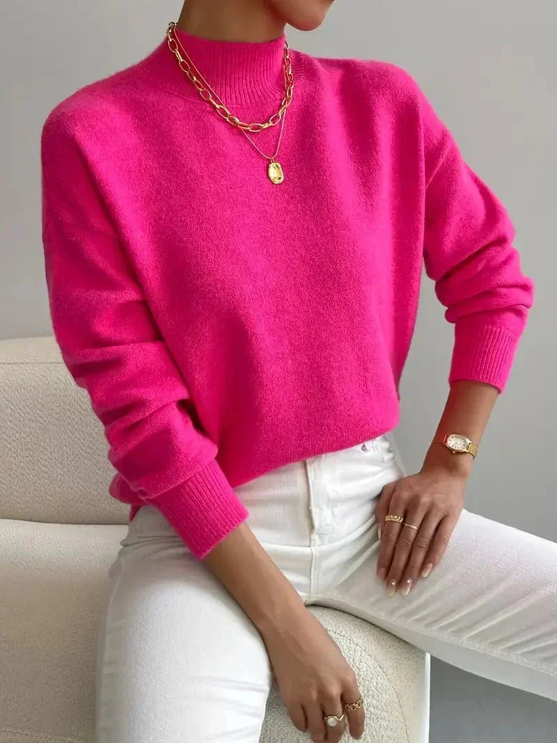 Women's crew neck sweater with ribbed cuffs and hemline in a solid shade