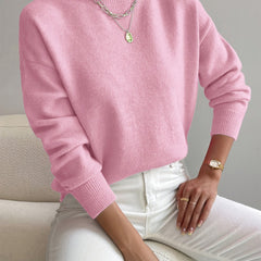 Women's crew neck sweater with ribbed cuffs and hemline in a solid shade