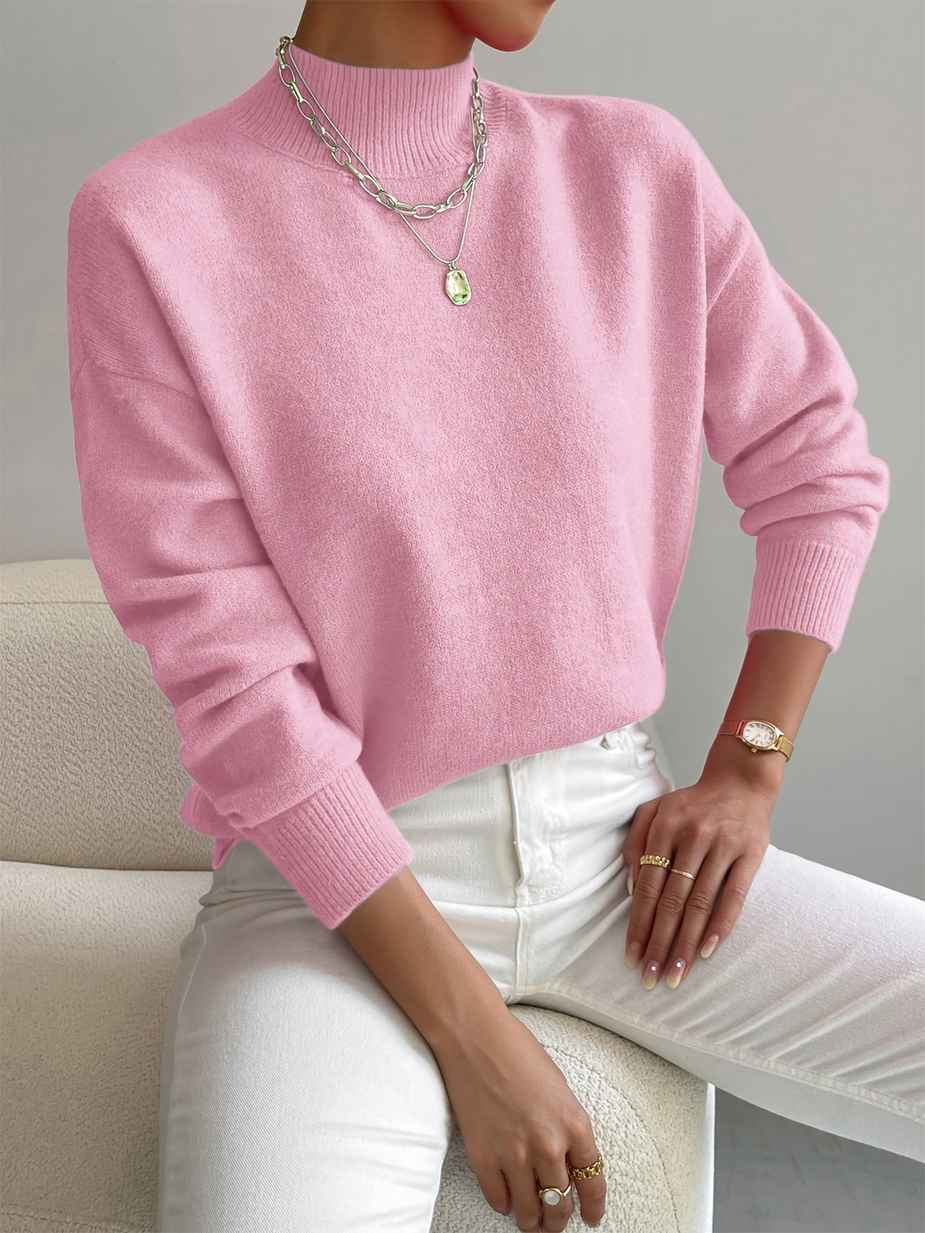 Women's crew neck sweater with ribbed cuffs and hemline in a solid shade