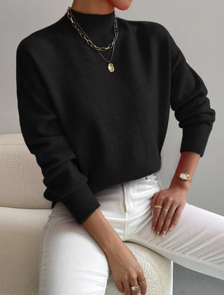 Women's crew neck sweater with ribbed cuffs and hemline in a solid shade