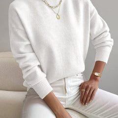 Women's crew neck sweater with ribbed cuffs and hemline in a solid shade