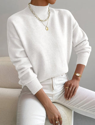 Women's crew neck sweater with ribbed cuffs and hemline in a solid shade
