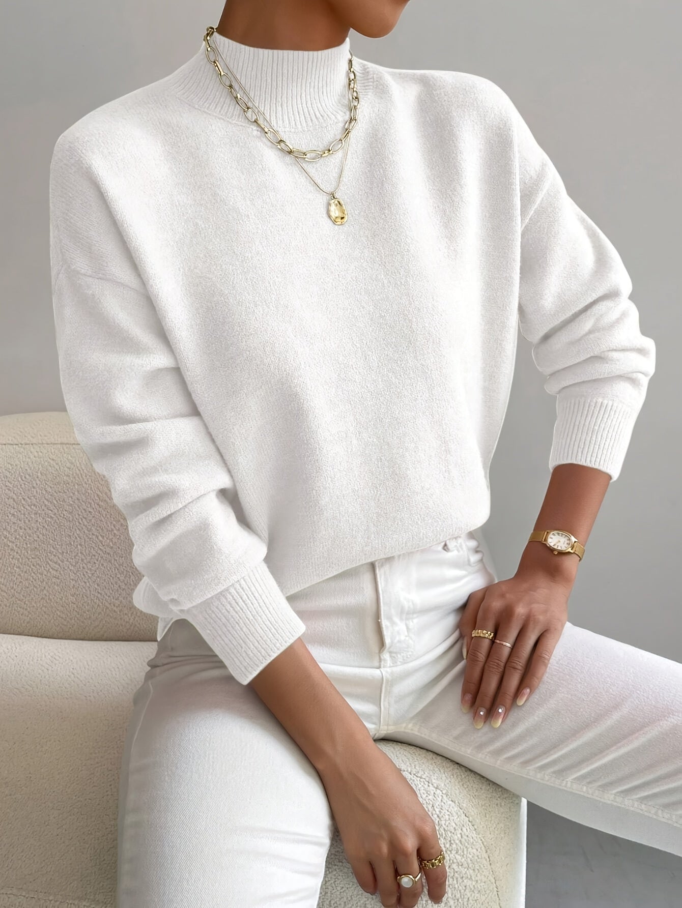 Women's crew neck sweater with ribbed cuffs and hemline in a solid shade