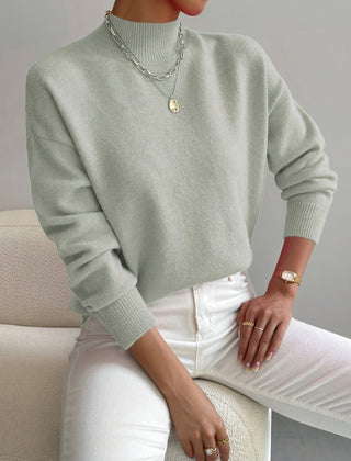 Women's crew neck sweater with ribbed cuffs and hemline in a solid shade