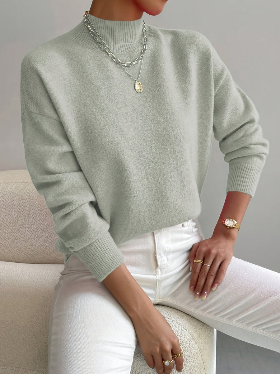 Women's crew neck sweater with ribbed cuffs and hemline in a solid shade