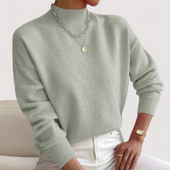 Women's relaxed crew neck long sleeve sweater with ribbed cuffs and hemline