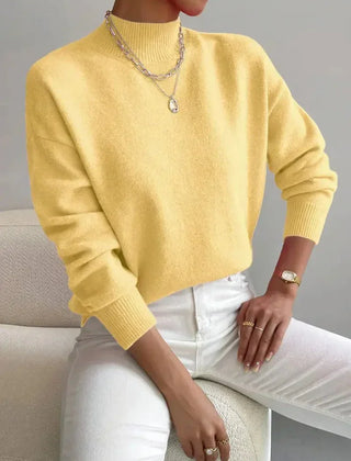 Women's crew neck sweater with ribbed cuffs and hemline in a solid shade