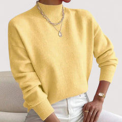 Women's relaxed crew neck long sleeve sweater with ribbed cuffs and hemline