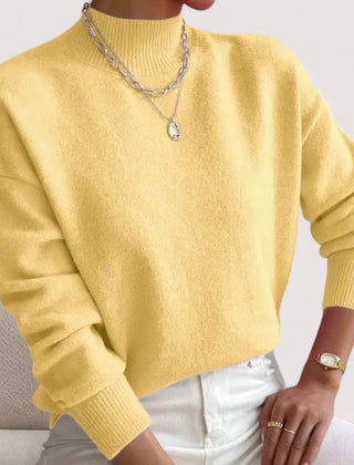 Women's relaxed crew neck long sleeve sweater with ribbed cuffs and hemline
