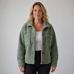 Woman wearing a soft fleece button-front jacket with lapel collar and side pockets