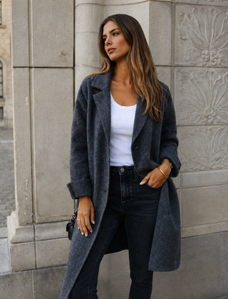 Melanie classic button coat with collar and pockets in a relaxed fit, shown for women