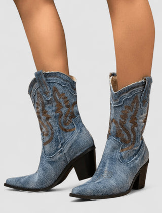 Embroidered western cowboy boots in faded blue with scrollwork shaft, pointed toe and block heel