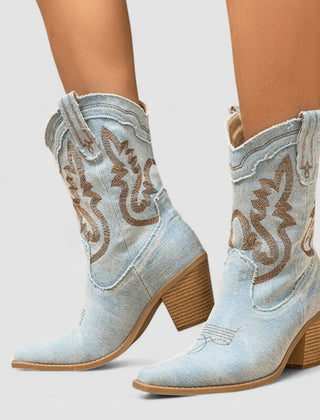 Embroidered western cowboy boots in faded blue with scrollwork shaft, pointed toe and block heel