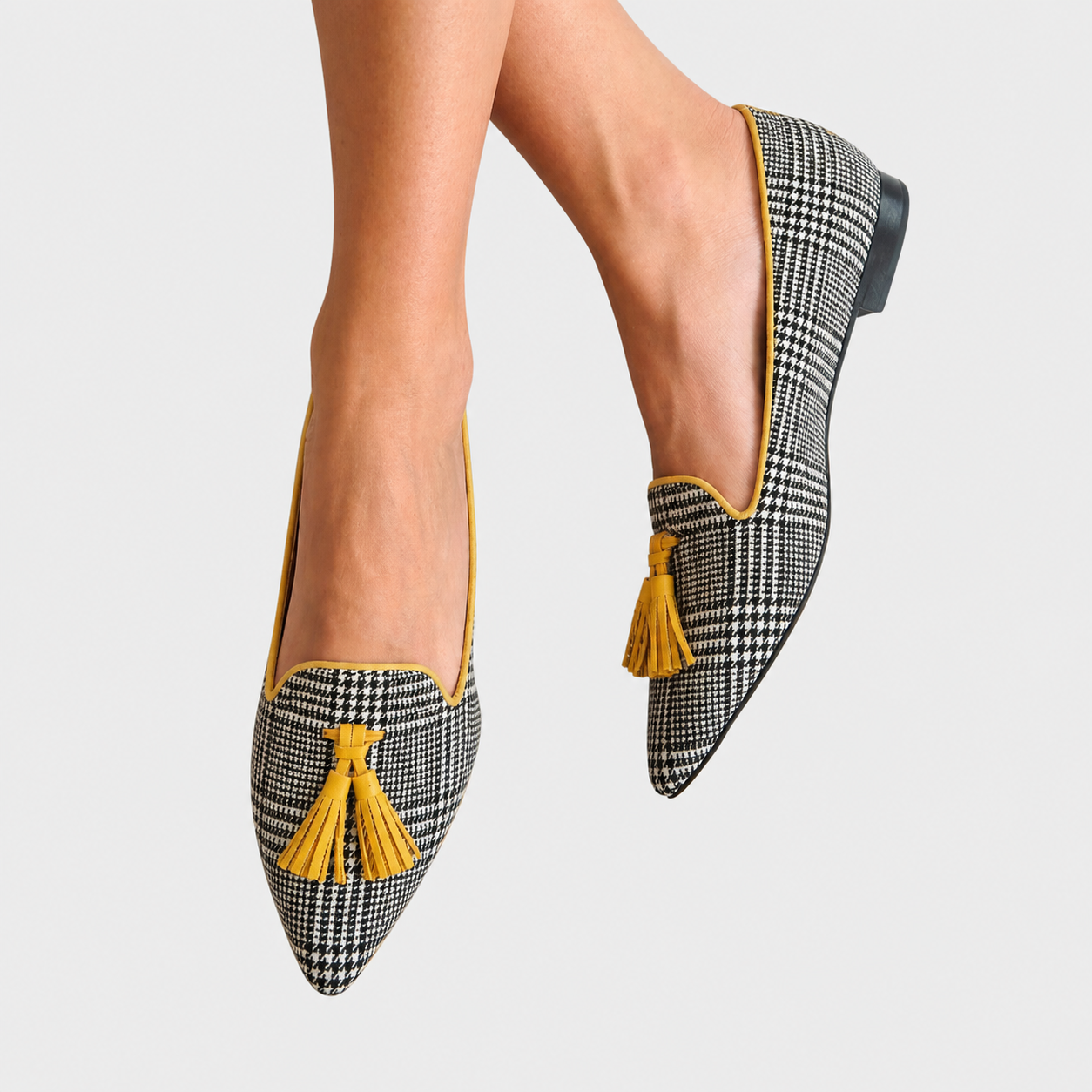 Women's slip-on loafers with a modern check print and refined finish