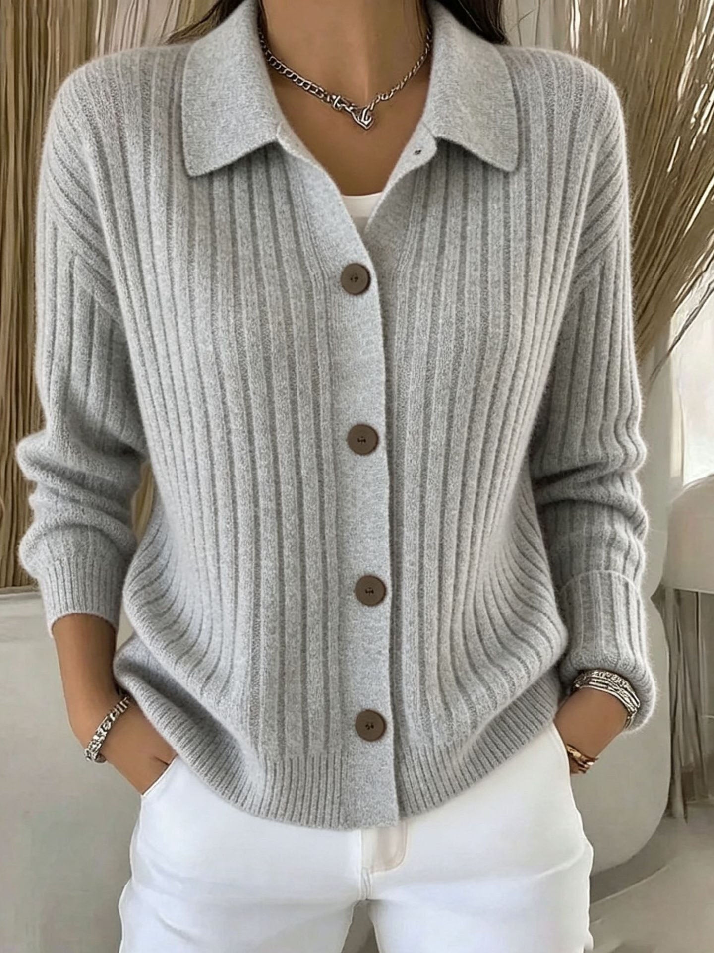 Blue ribbed collared button-down cardigan sweater with a relaxed fit