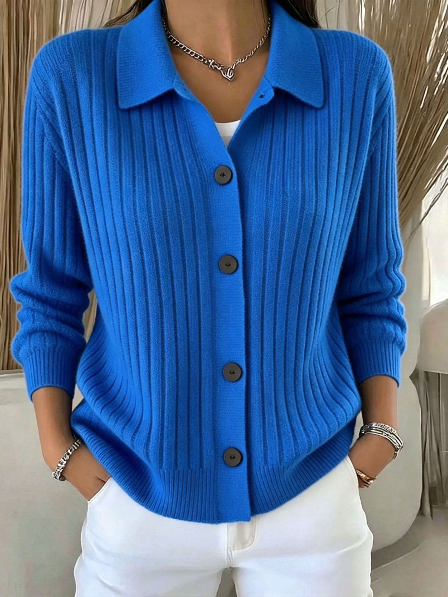Blue ribbed collared button-down cardigan sweater with a relaxed fit