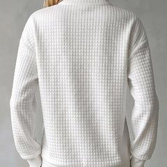 Women's waffle knit stand collar long sleeve pullover sweater in a relaxed fit
