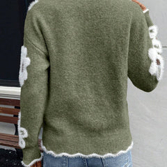Floral knit sweater with scalloped V-neckline and relaxed fit in five colourways