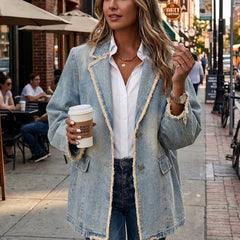 Light wash blue oversized blazer with raw edges, notched lapel and flap patch pockets