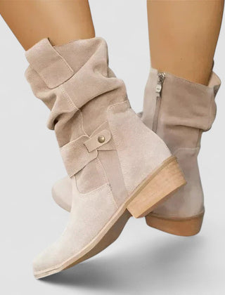 Slouch-style Western boots with low block heel, side zip and ankle buckle strap