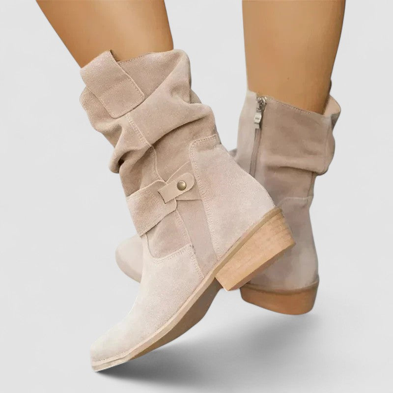 Slouch-style Western boots with low block heel, side zip and ankle buckle strap
