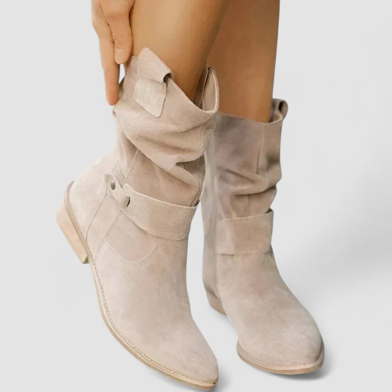 Slouch-style Western boots with low block heel, side zip and ankle buckle strap