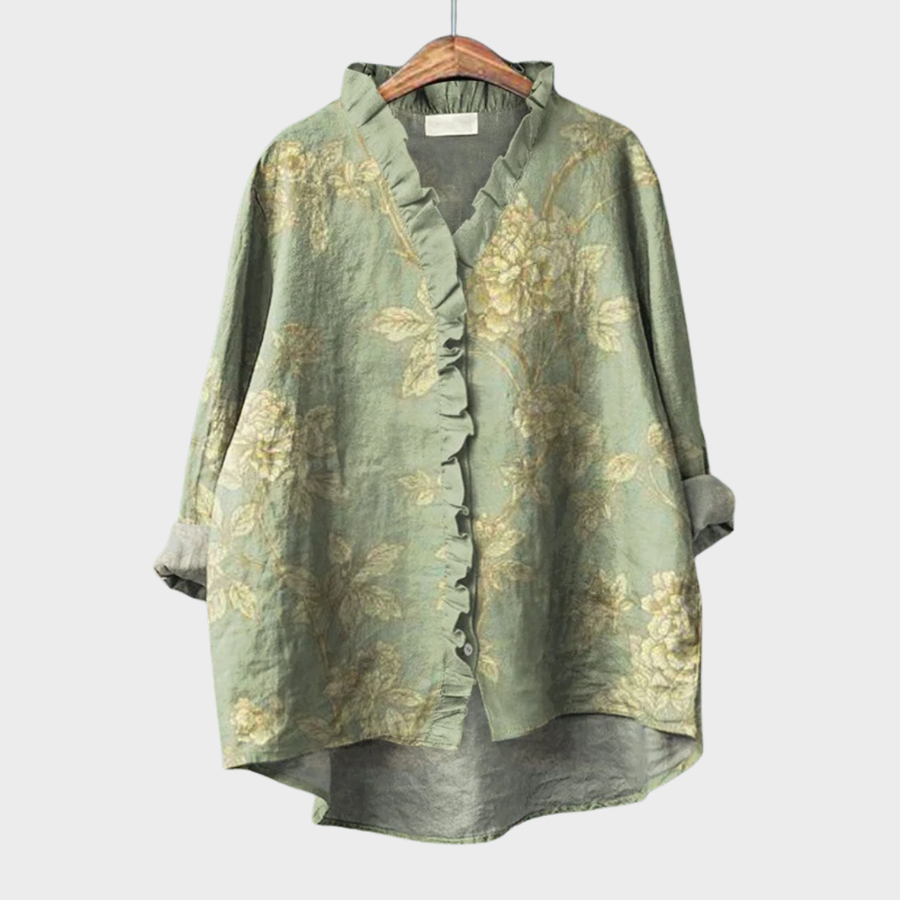 Green floral blouse with delicate ruffle trim and a relaxed, gently draped fit
