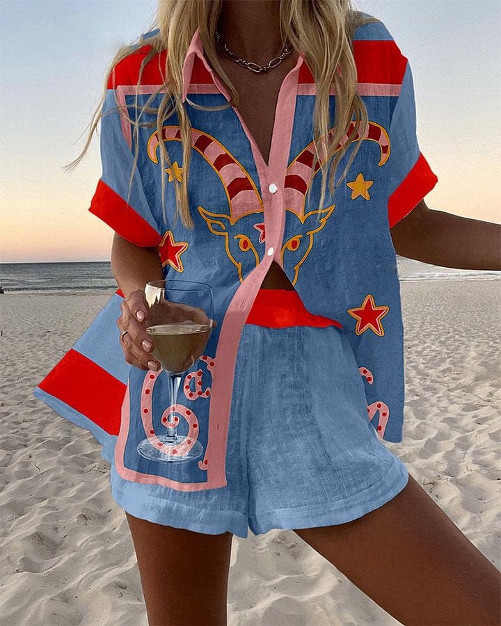 Sky blue summer coordinated set with celestial Capricorn print, red shoulder panels and pink contrast details