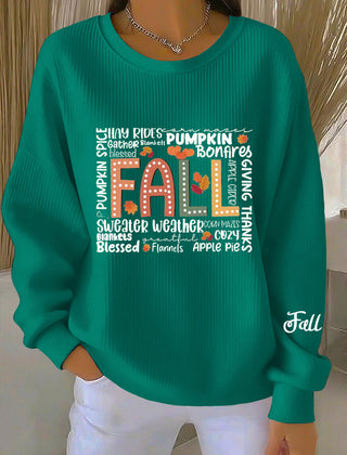 Women's blue green crew neck sweatshirt with front text graphic, sleeve print and ribbed cuffs and hem
