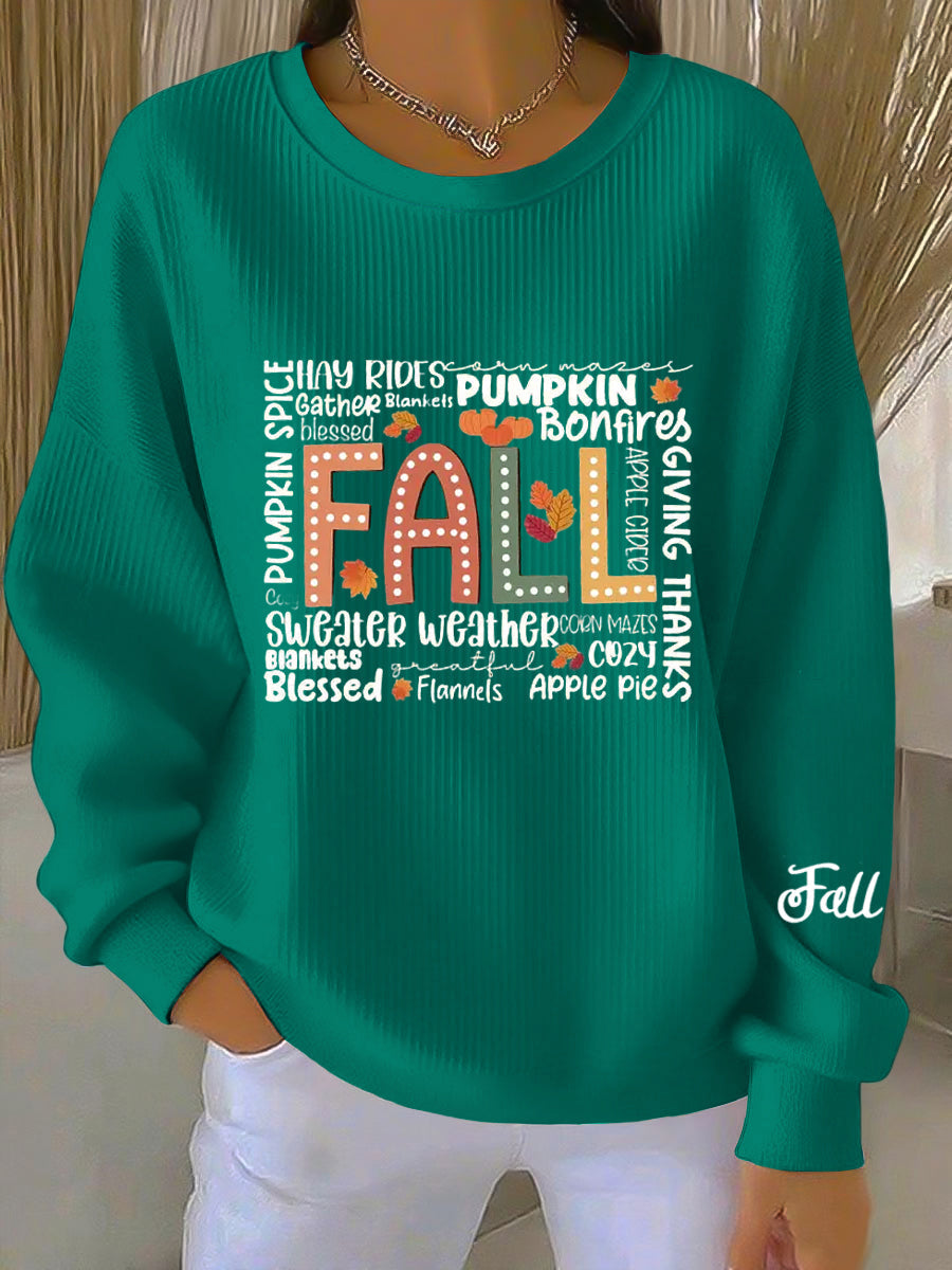 Women's blue green crew neck sweatshirt with front text graphic, sleeve print and ribbed cuffs and hem