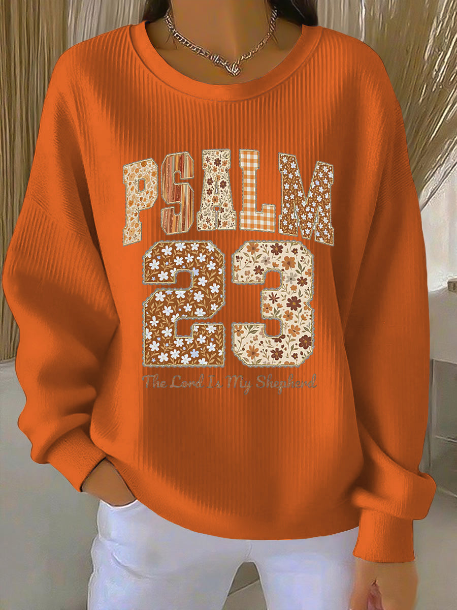 Women's orange crew neck sweatshirt with front graphic print and ribbed cuffs and hem